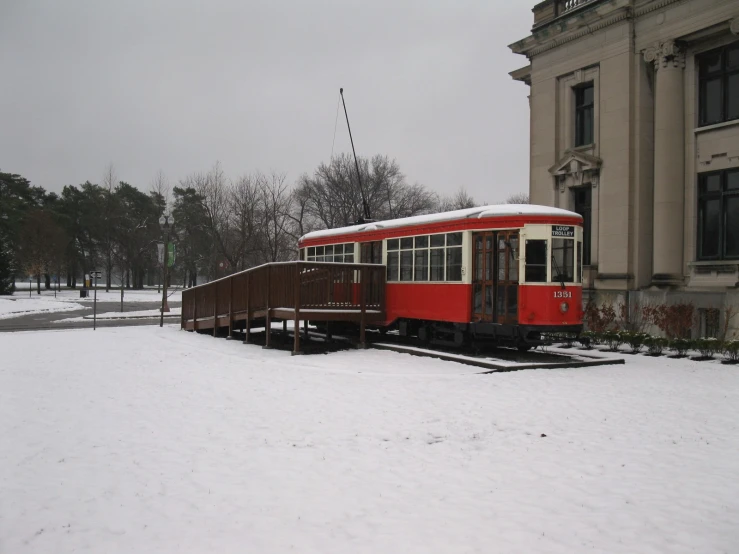 a train is traveling down the tracks in the snow