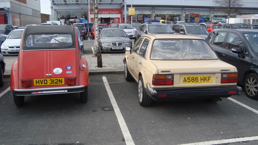 cars in a parking lot at a car shop