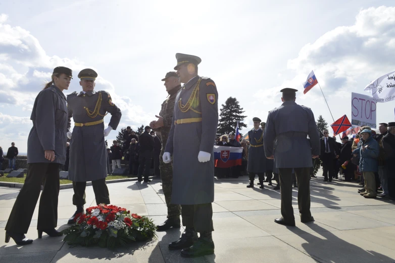 a group of soldiers standing around a wreath