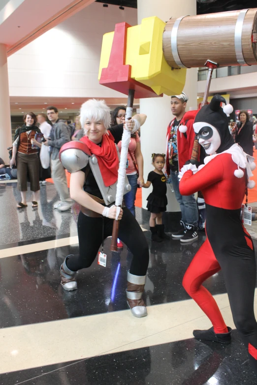 two people dressed in costumes in a shopping mall