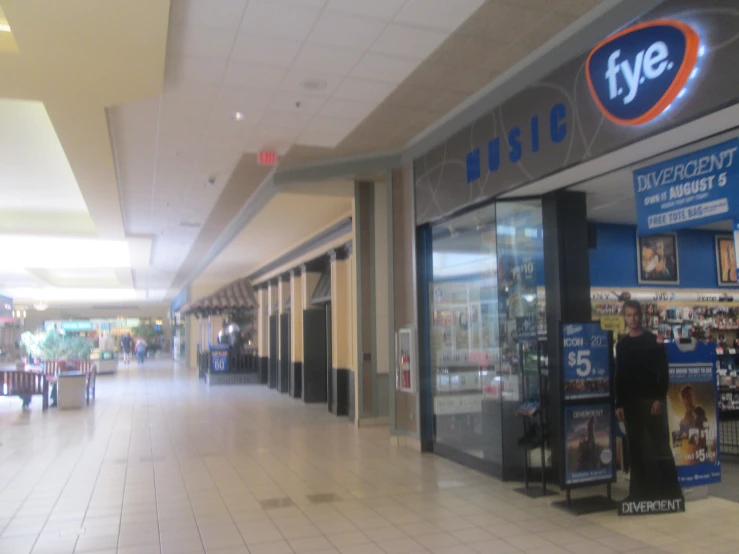 the inside of a store with signs on the store walls