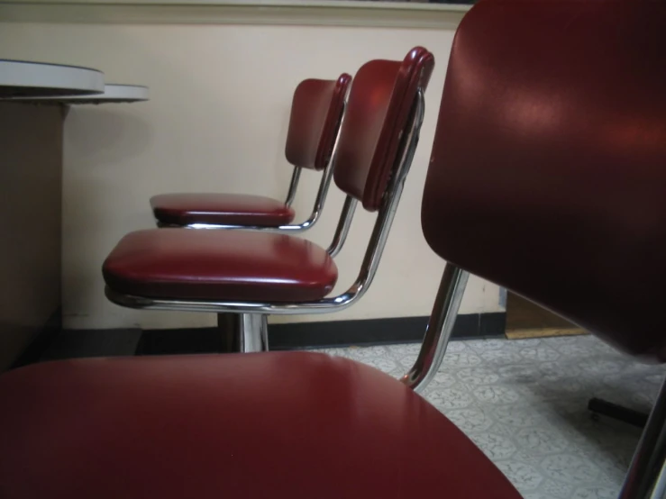 a row of chairs that are in a room