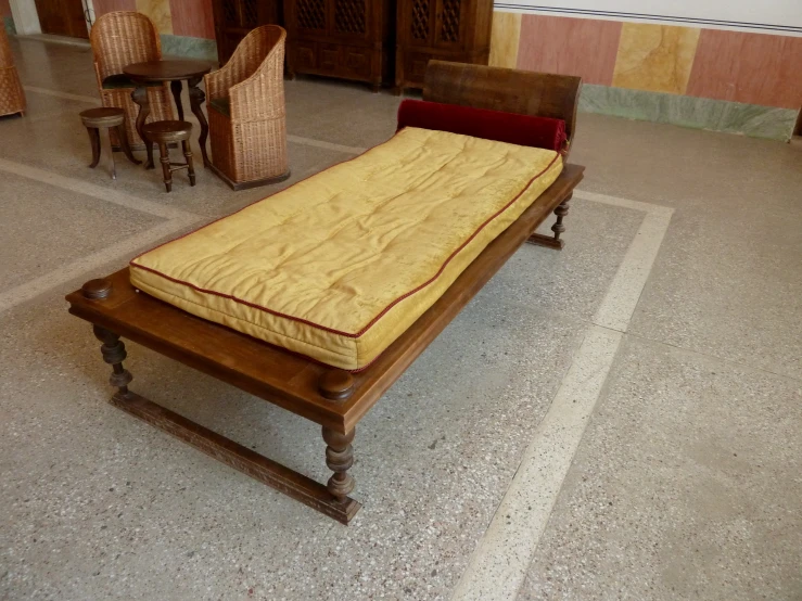 an older antique style bed on display at a museum