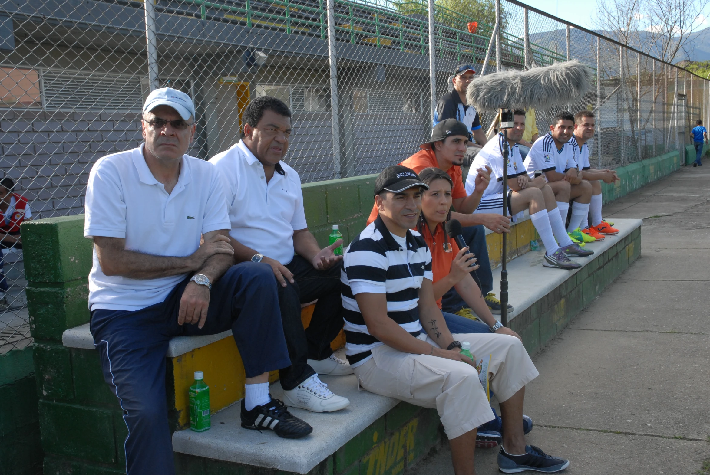 many people are sitting on the bleachers