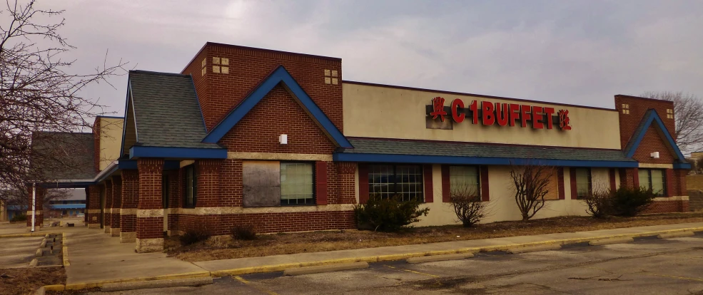 a large building with a sign for a chinese restaurant