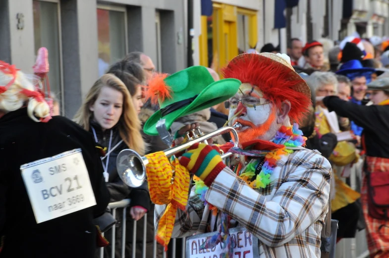 some people wearing clown makeup and some musical instruments