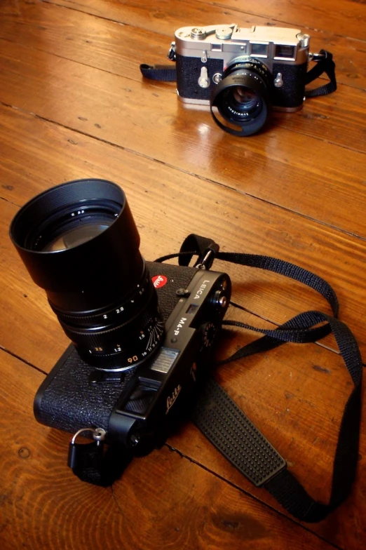 a camera and some lens equipment sitting on top of a table