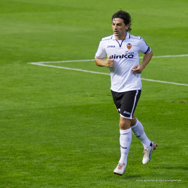 a man running around in a soccer field