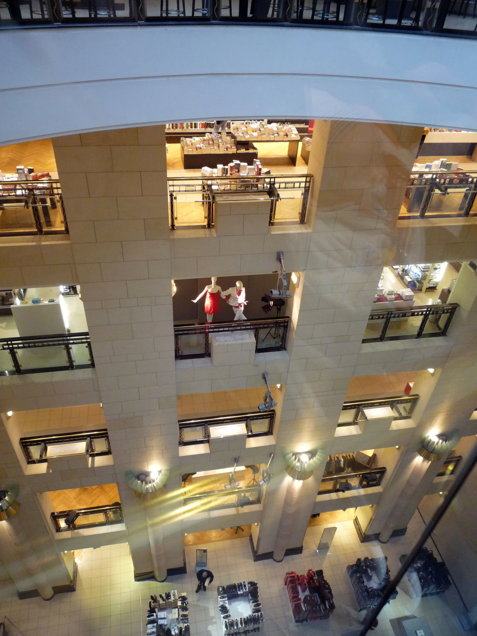 a very high view looking down on a building at the inside of it