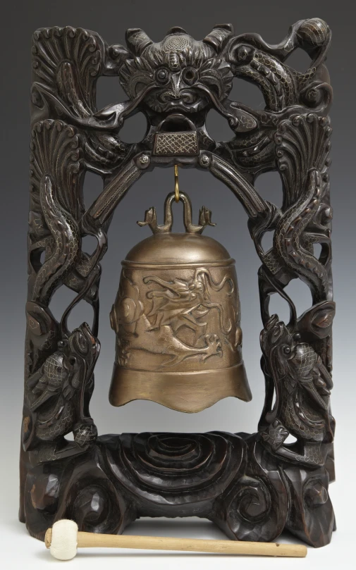 decorative bells with designs surrounding them are in the foreground