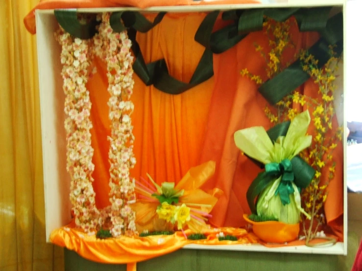 the room has a green and orange stage decoration