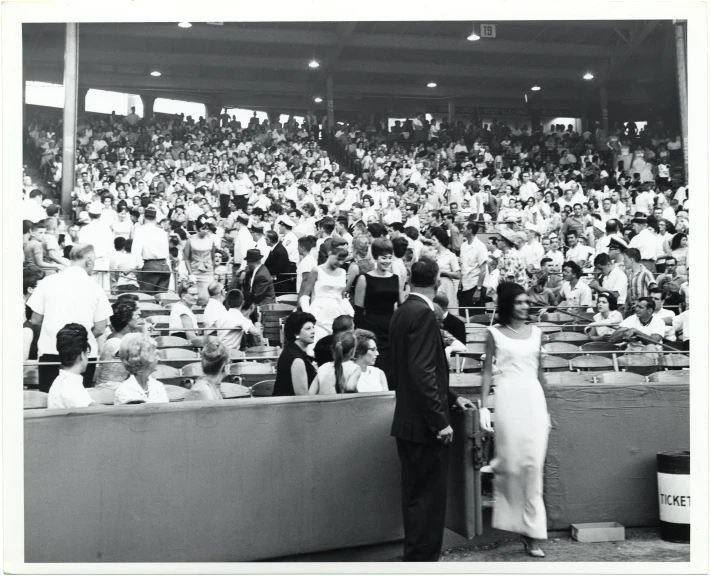 a couple in front of a crowd of people