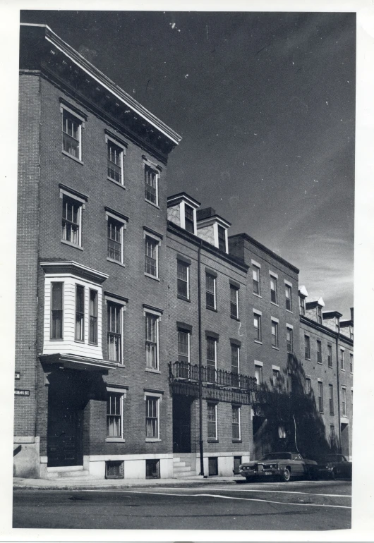 an old building sits near some tall buildings