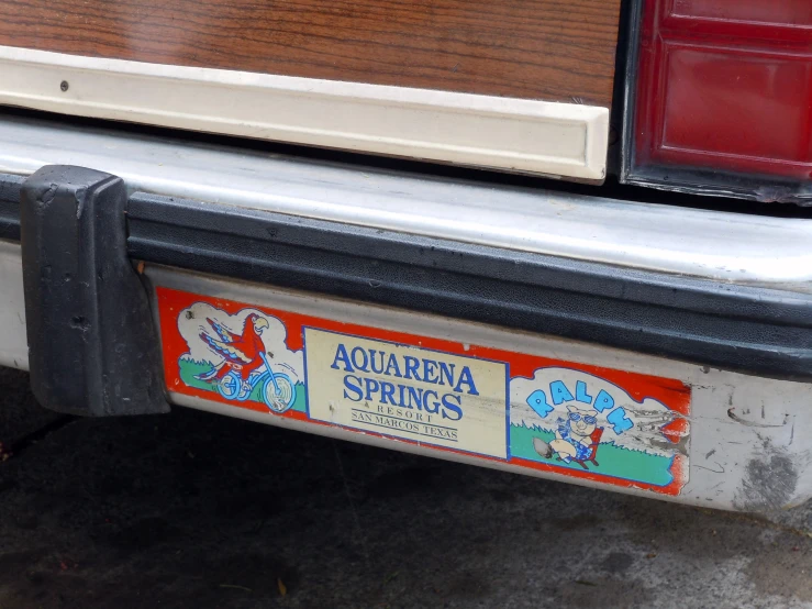 the sticker is posted on the rear end of an old car