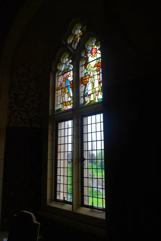 a room with a large stained glass window in it