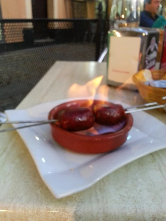 a plate with some food on it and a large fork in it