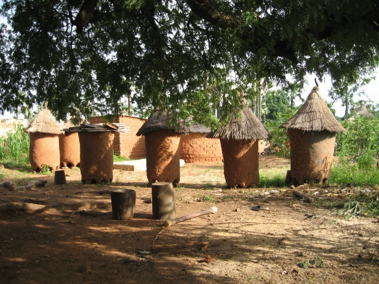 a bunch of clay pots lined up in a park