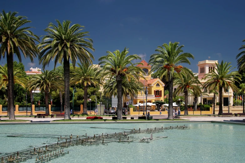 a beautiful fountain with two people walking around it