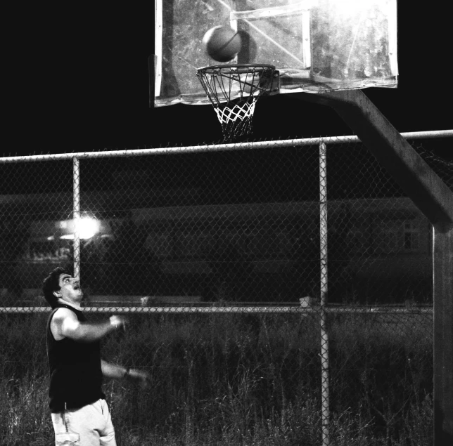 a man hitting a basketball in the air