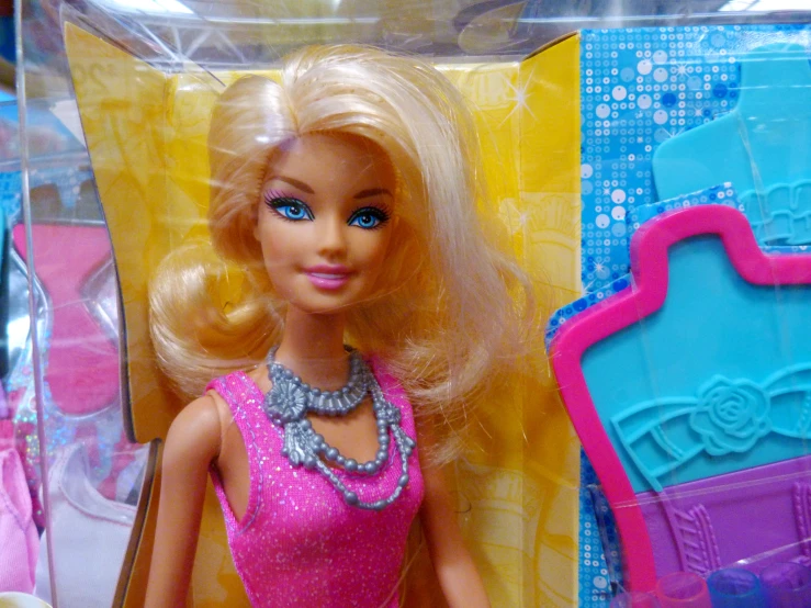 a close up of the barbie doll has blue eyes