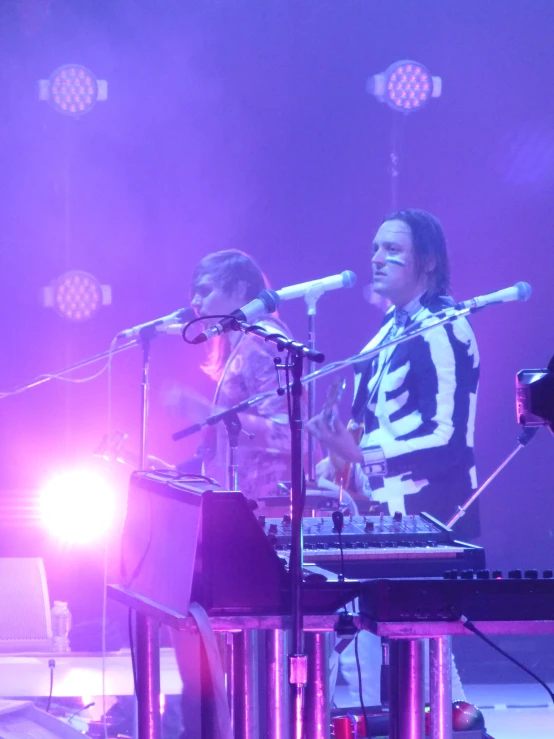 two women on keyboards with one woman at the piano