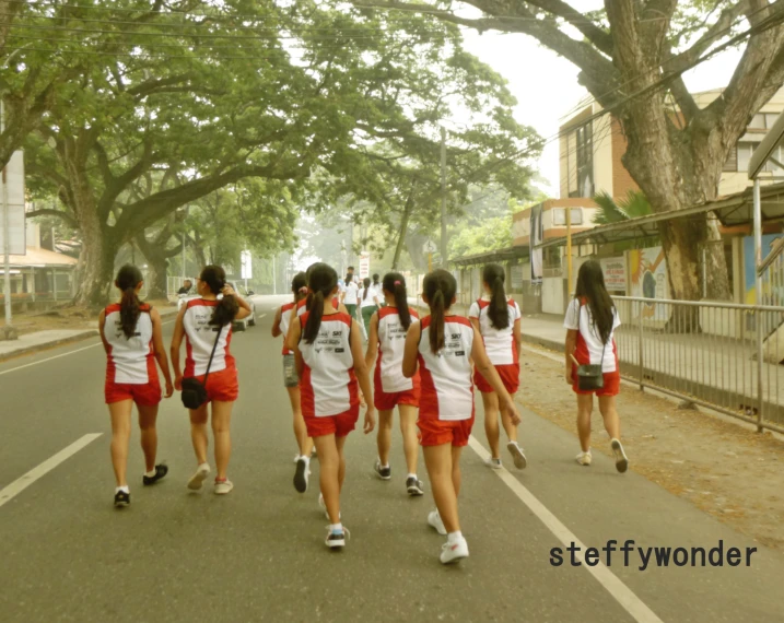 group of young women walking on the street