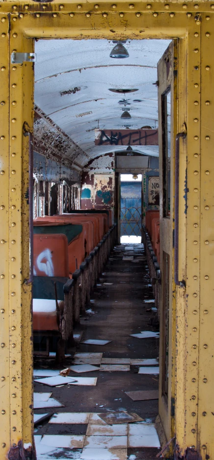 an old looking train car filled with lots of doors