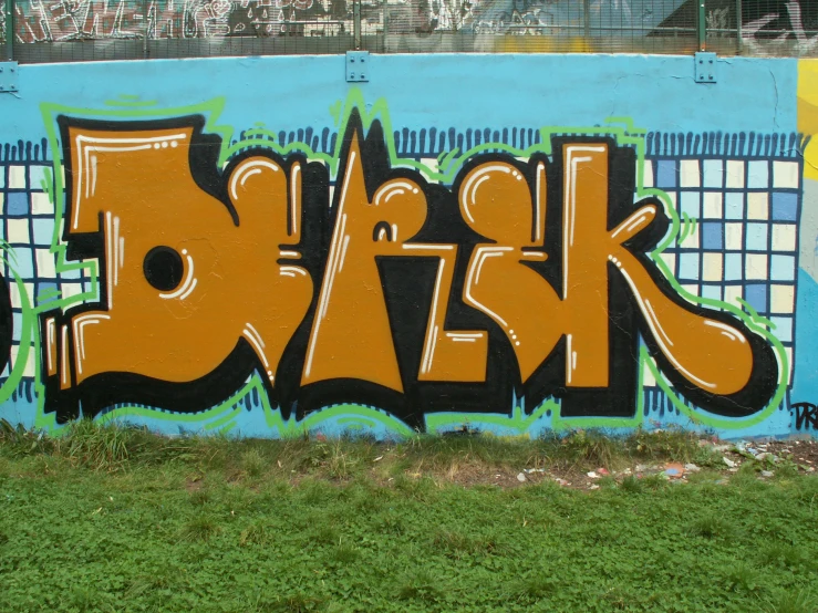 a graffiti covered wall that says break