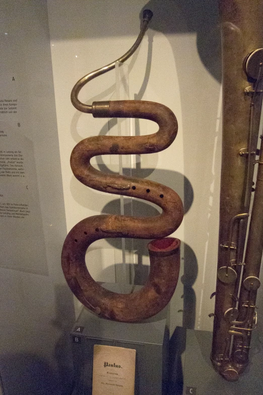 there is a trumpet next to a snake statue
