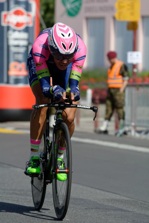 man riding a bike wearing a helmet and glasses