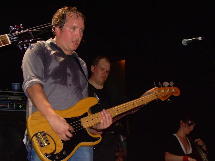 a man that is holding onto some kind of guitar