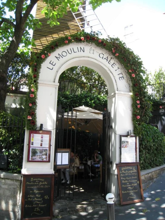 a large white arch on the outside of a building