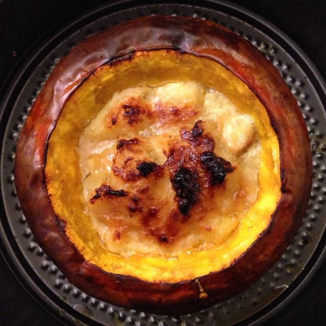 the inside of an cooked squash dish is being pographed