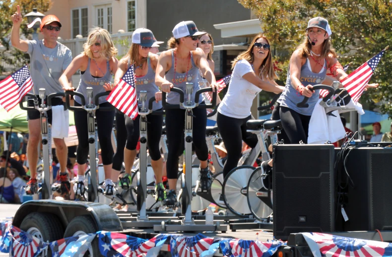 a group of girls that are on some bicycles