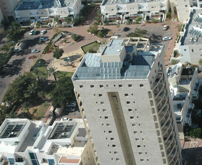 an aerial view of the outside of a skyscr with a blue roof