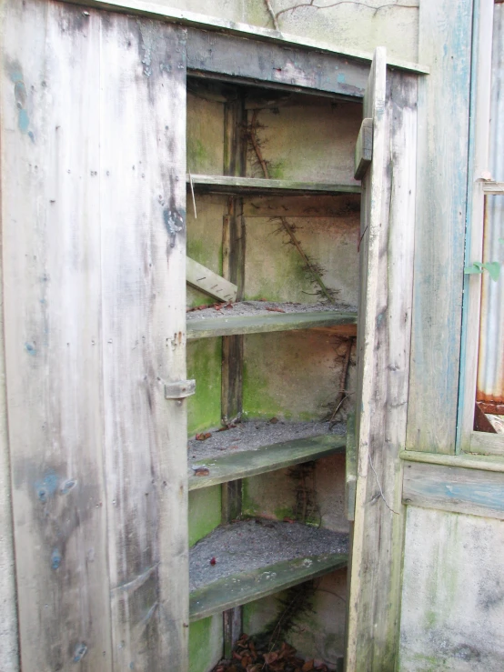 an empty shelving unit in the barn