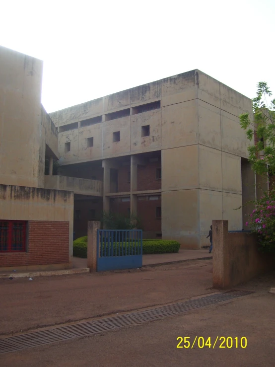 a very big old building by some plants