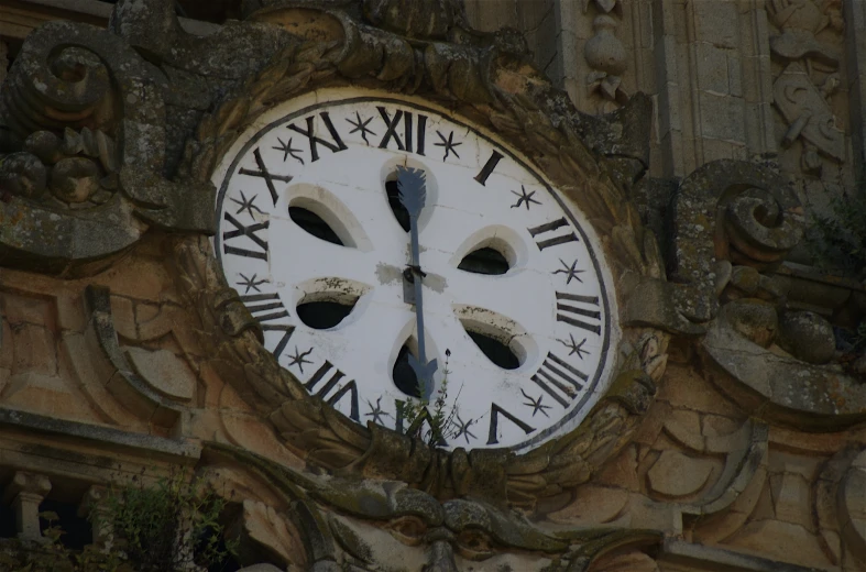 the round clock is visible from under the building