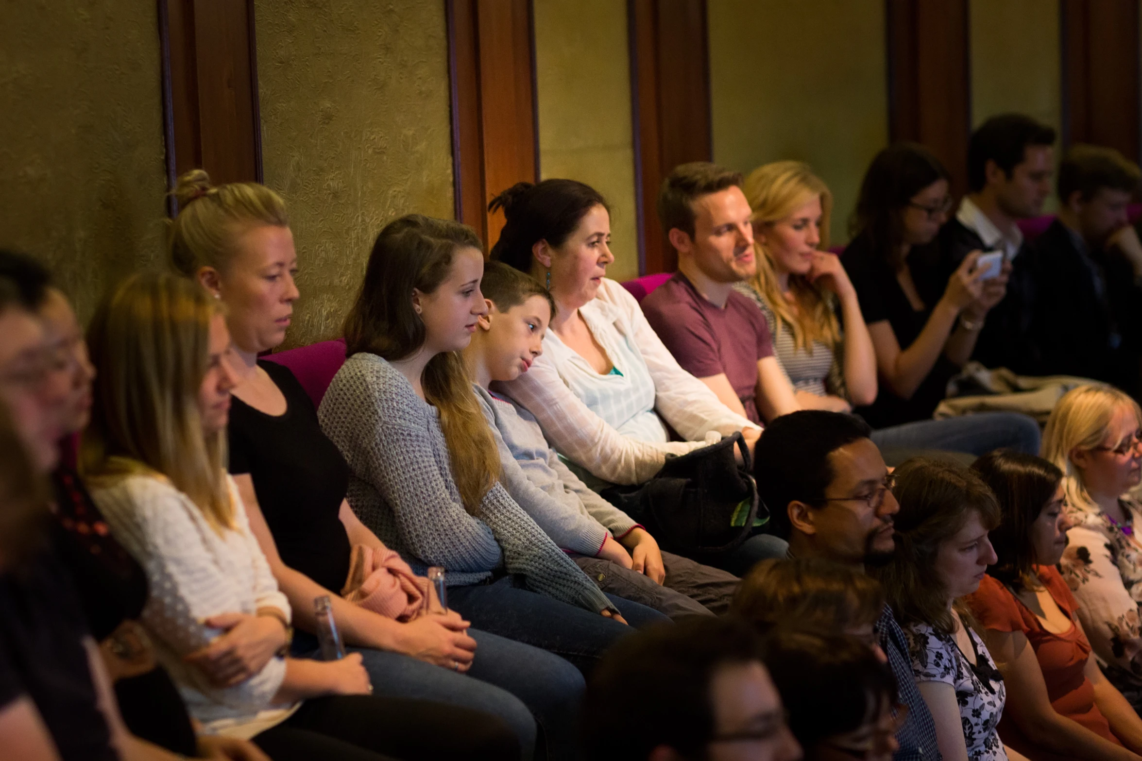 a group of people in a lecture room