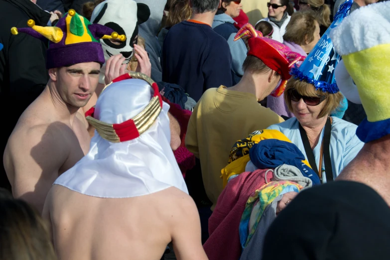 some people dressed in funny outfits at a festival