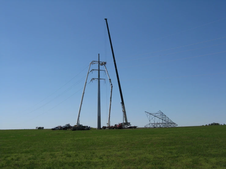 the sky is blue and clear and the power lines are green