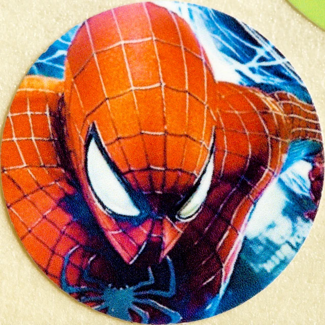 a spiderman face with white teeth is shown on the paper