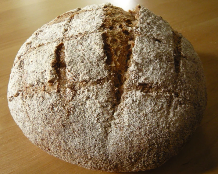 an interesting looking baked piece of bread on top of a table