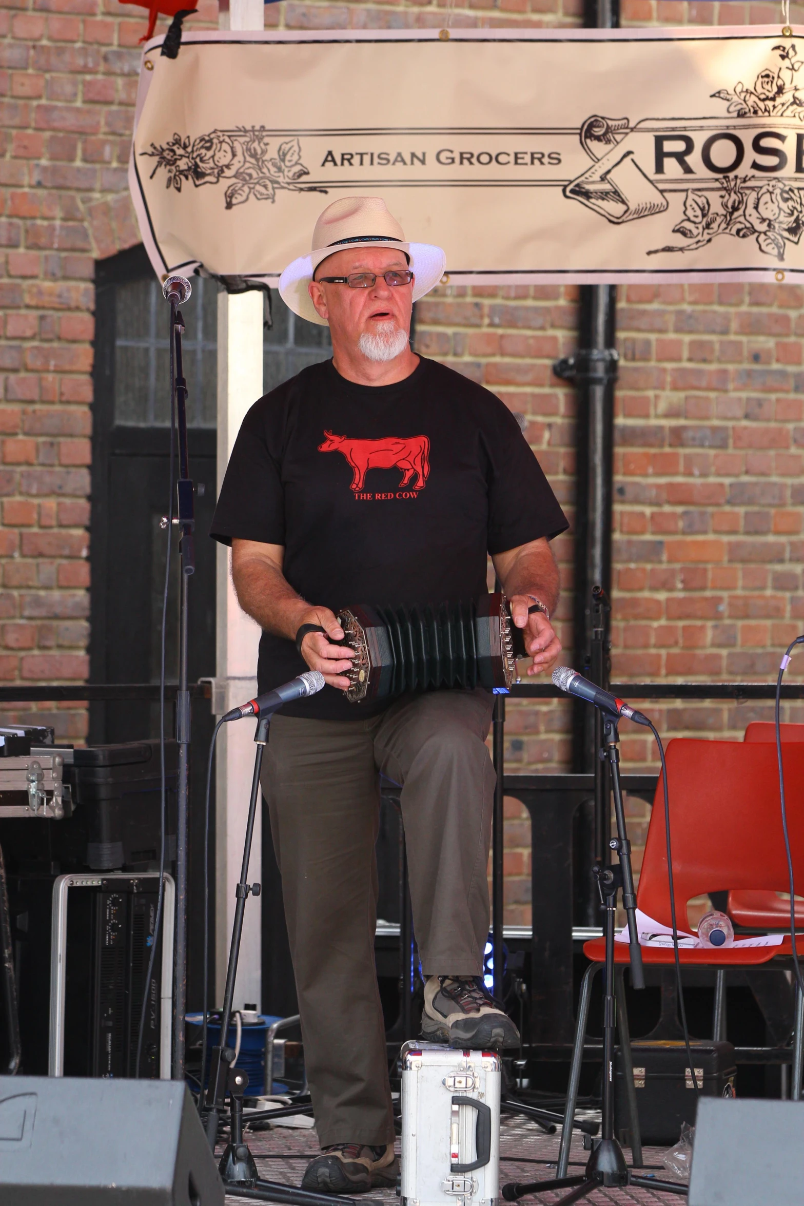 a man plays a sitar on a stage