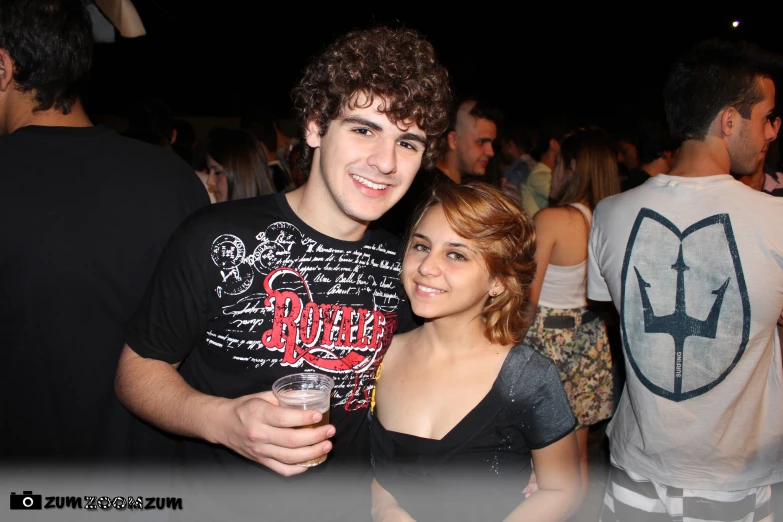 two young people having a party and posing for the camera