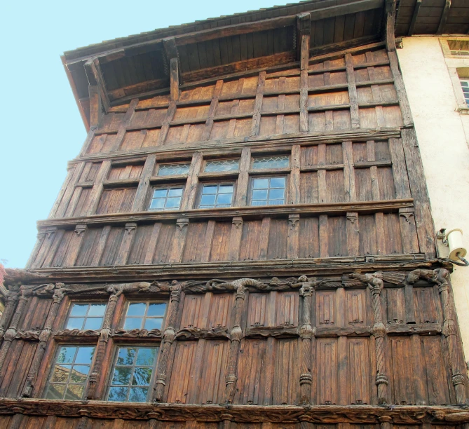 a very old style building has a bunch of windows