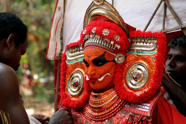 a person that is standing with a mask on