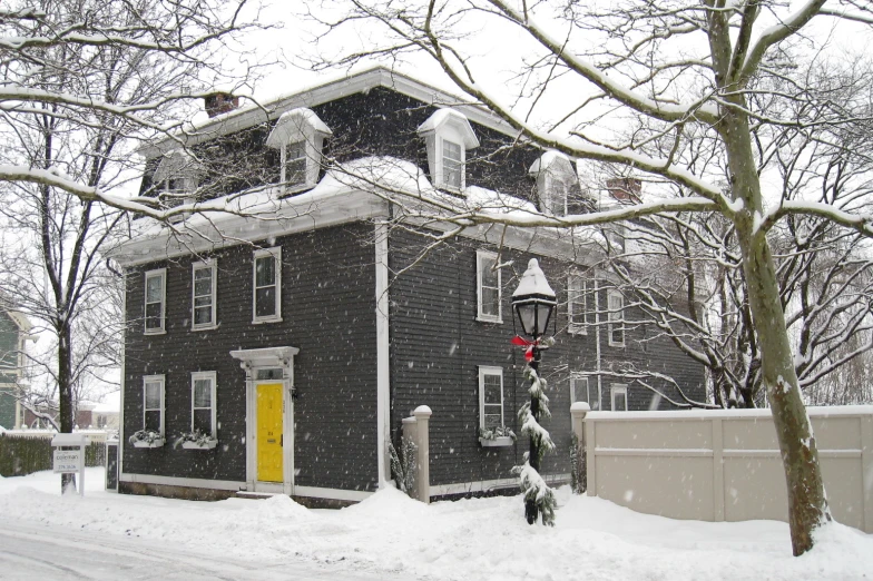 an old house that has been covered in snow