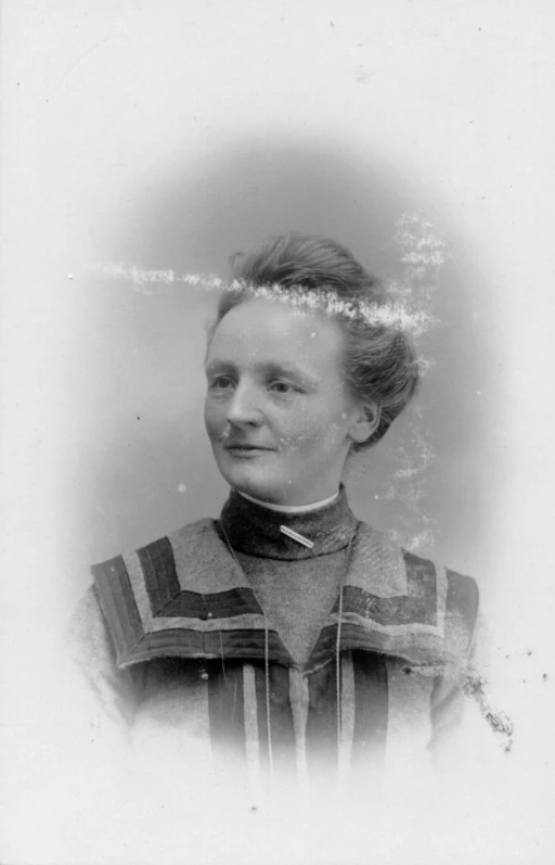 black and white pograph of a woman in a striped sweater