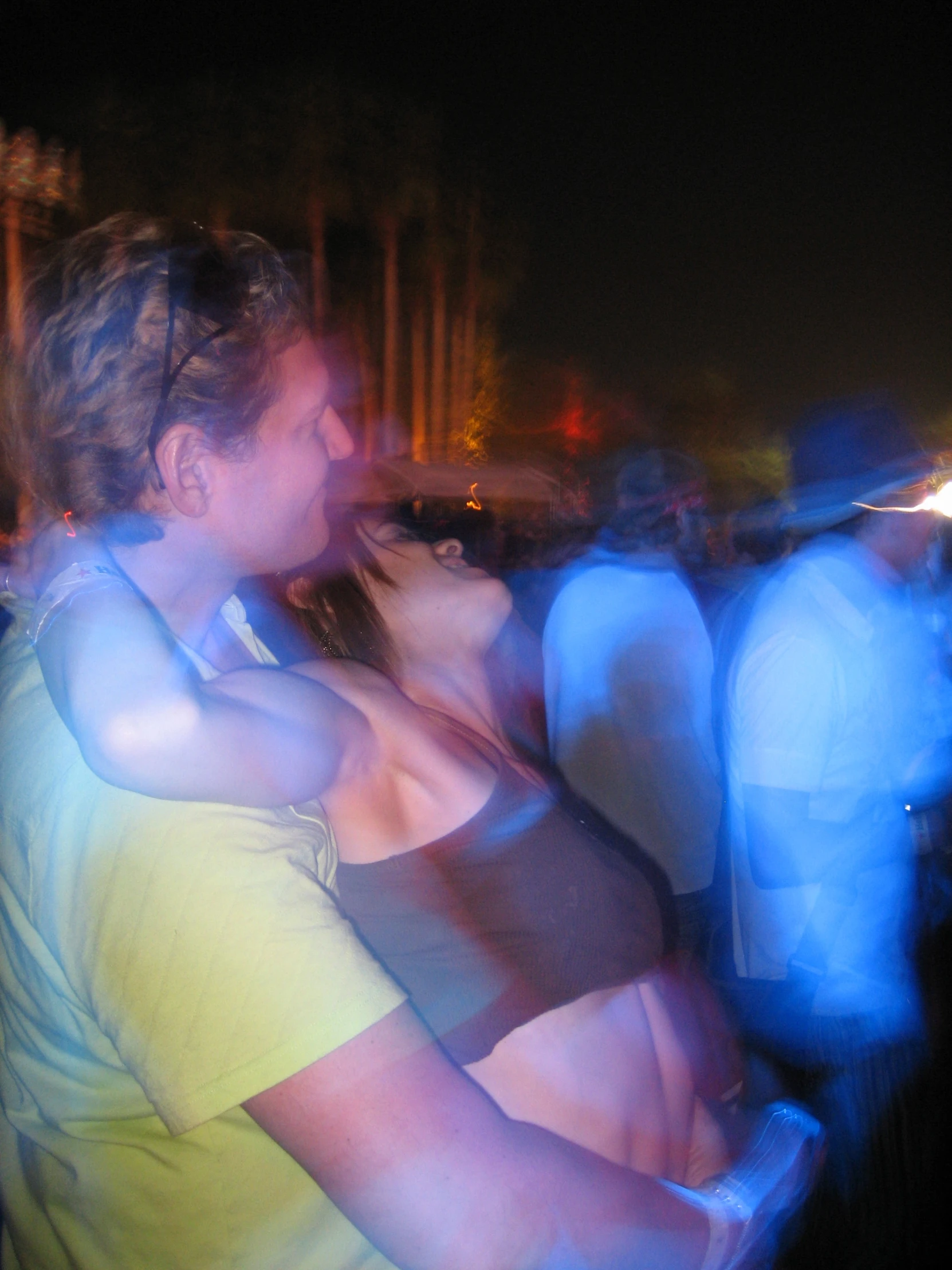 a woman and man are dancing at a club